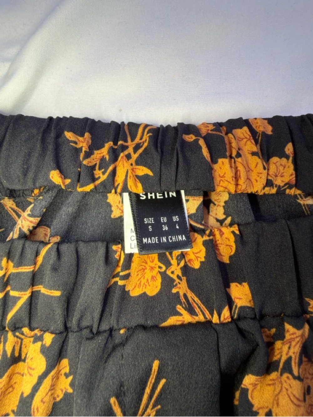 SHEIN Black Skirt with Orange Floral Print and Ruffle Hem - Picture 3 of 3